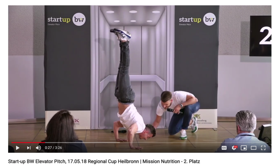 The Team Mission Nutrition performs a handstand during their pitch at Startup BW Elevator Pitch.